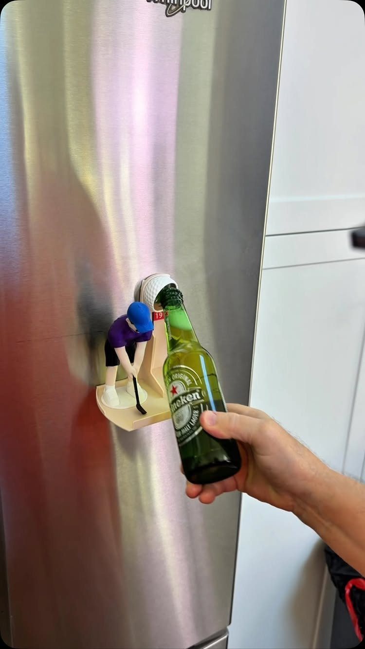 20 Ideal Boyfriend Gifts He'll Actually Use and Keep 13 Hand opening a beer bottle using a hockey player themed wall-mounted bottle opener.