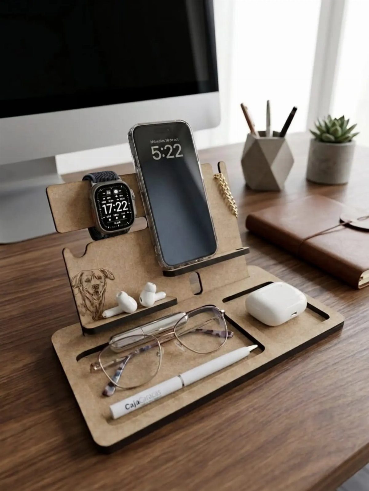 20 Ideal Boyfriend Gifts He'll Actually Use and Keep 6 Wooden docking station holding a smartphone, smartwatch, glasses, and earbuds on a desk.