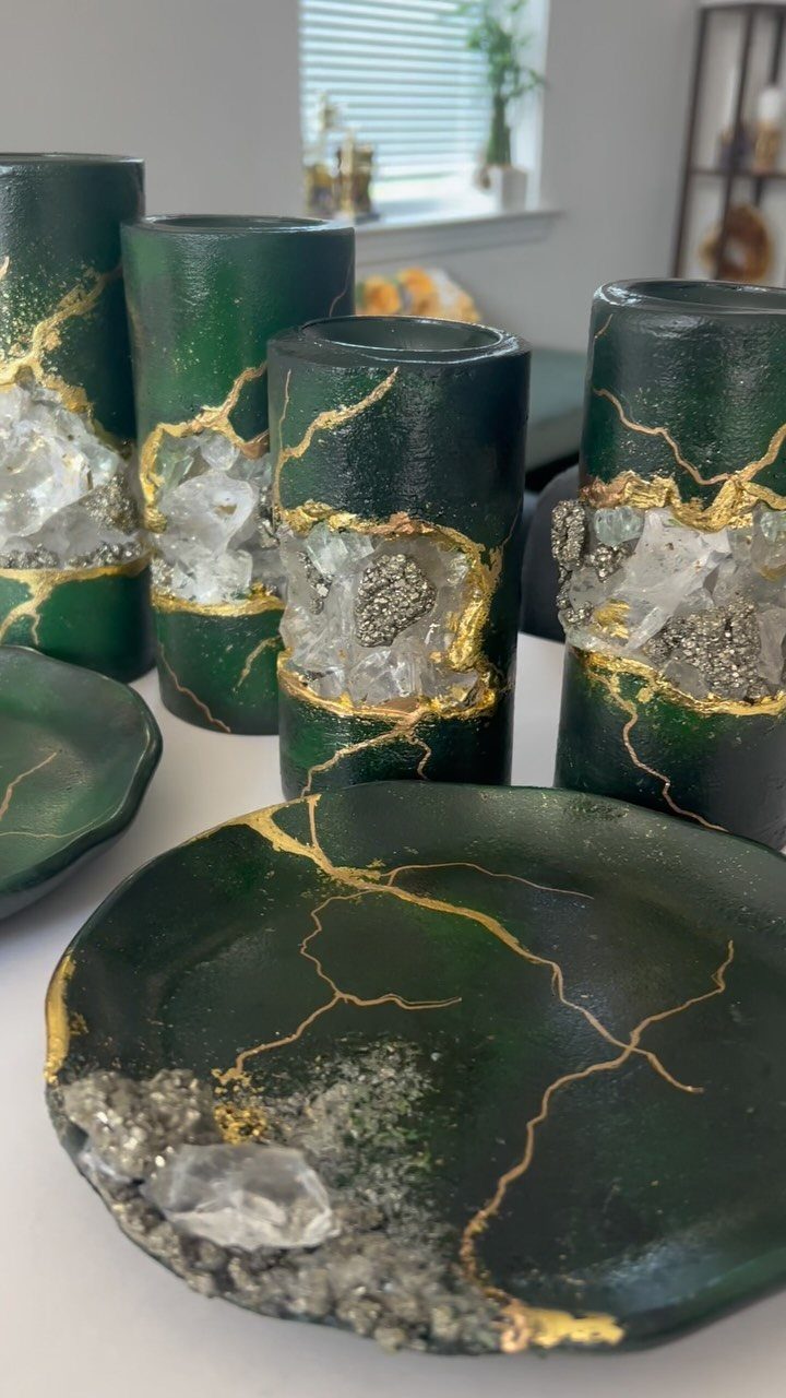 Dark green resin coasters and holders with gold veins and embedded crystals.