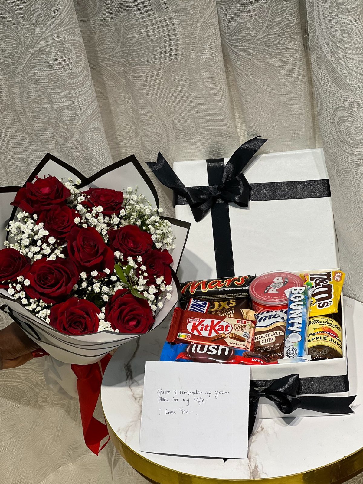 National Boyfriend Day Gifts: 12 Ideas for Him 2 Red roses bouquet and a white gift box filled with assorted chocolates.