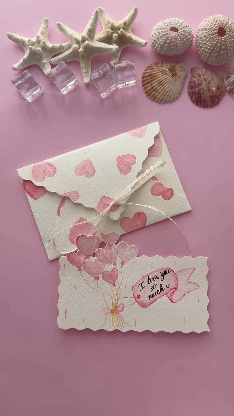 National Boyfriend Day Gifts: 12 Ideas for Him 11 Handmade heart-themed card and envelope surrounded by seashells and starfish on pink background