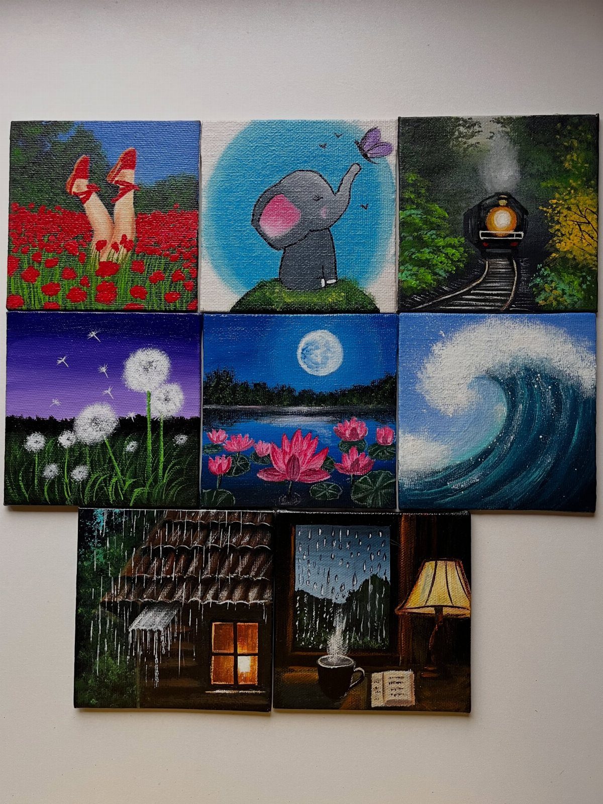 12 Paintings as Gifts for Every Budget and Taste 10 Eight small square canvas paintings with various nature and cozy scenes on a wall