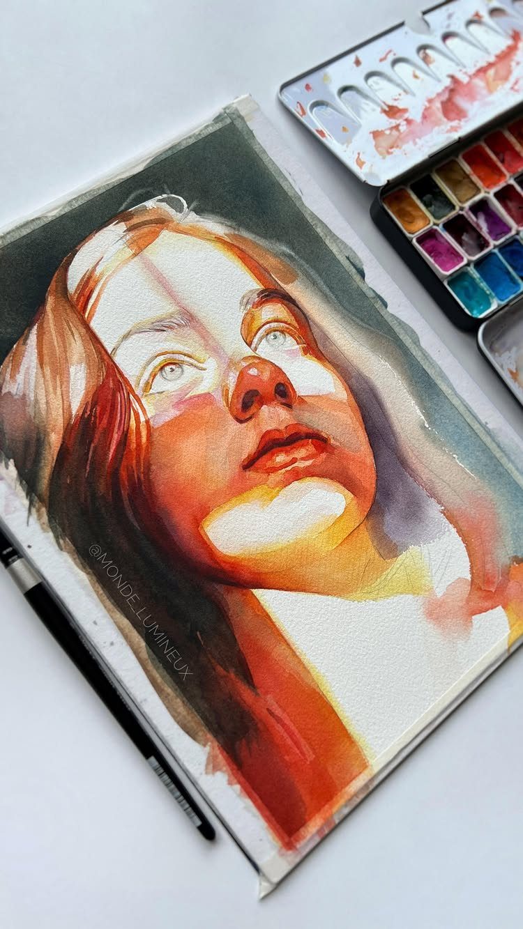 12 Paintings as Gifts for Every Budget and Taste 2 Watercolor portrait of a woman with warm tones beside a paint set
