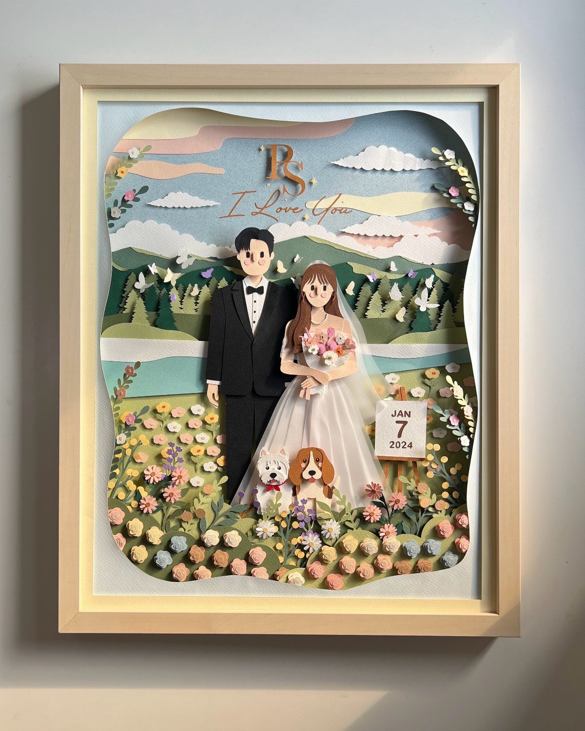 Framed 3D paper art of a wedding couple and dogs in a meadow