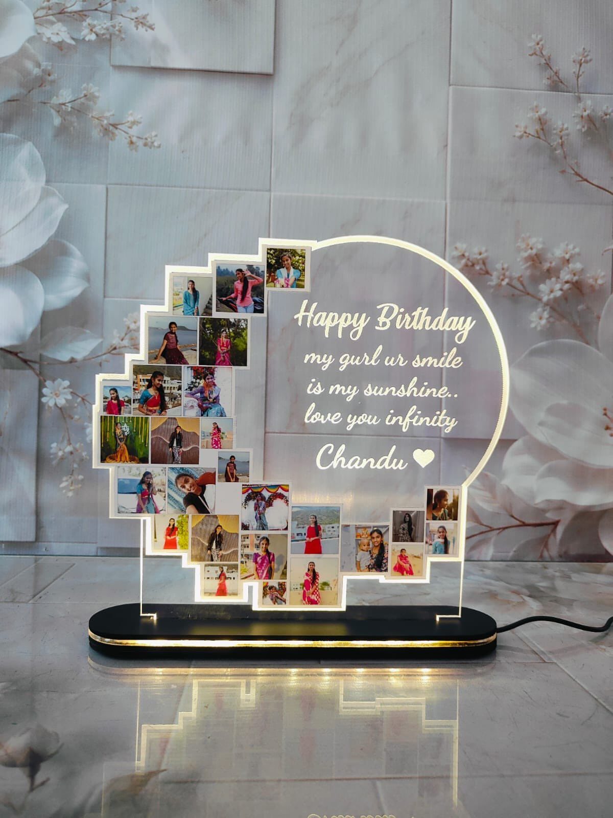 Acrylic photo plaque with birthday message and small personal pictures on LED base