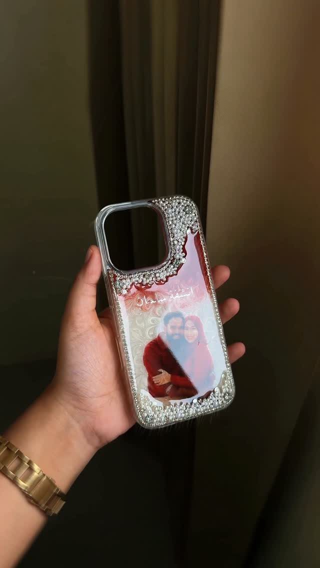 Custom phone case with a rhinestone border and a photo of a couple.