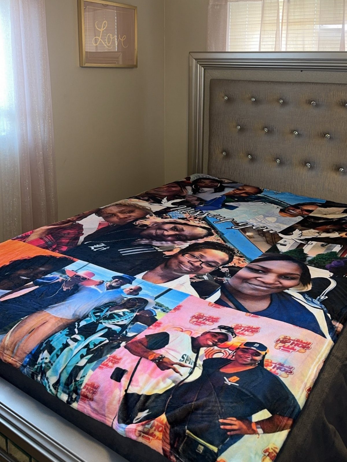 Custom photo blanket with a collage of portraits spread across a bed.