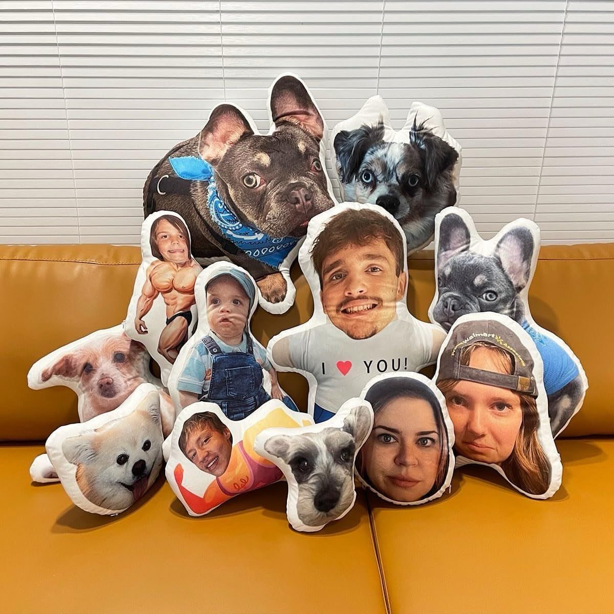 Custom shaped pillows with printed photos of pets and people on a tan sofa.
