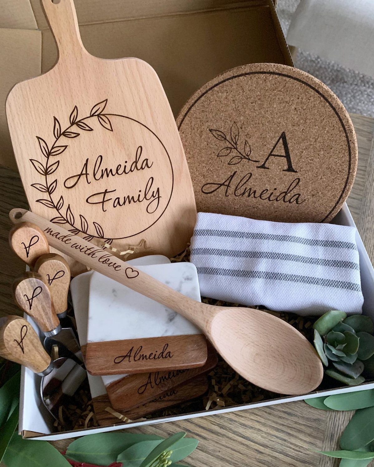 Personalized wooden kitchenware gift set with engraved name in a white box.