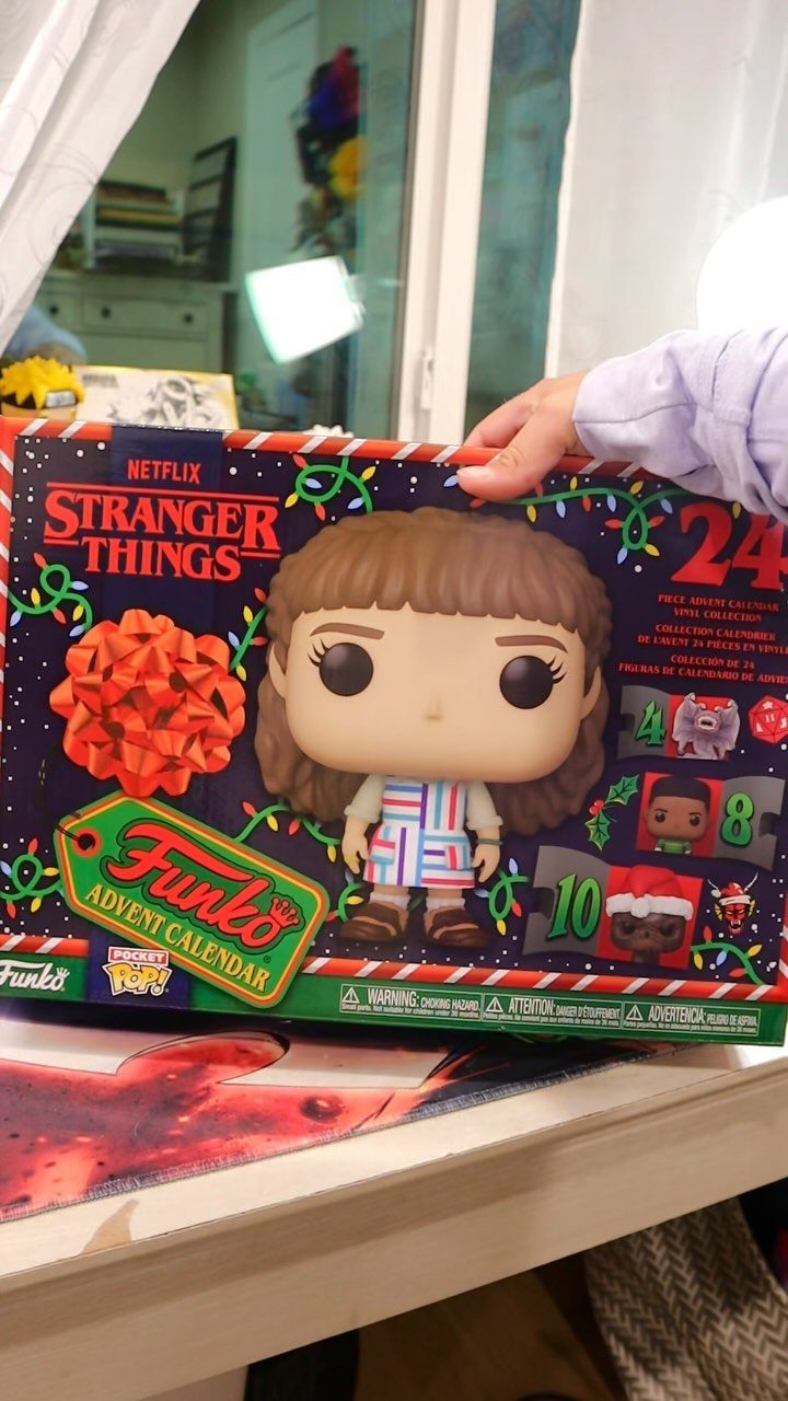 Stranger Things Funko advent calendar box with Eleven figure and red bow.