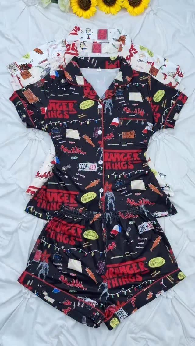 Black Stranger Things pajama set with logo and characters on white fabric