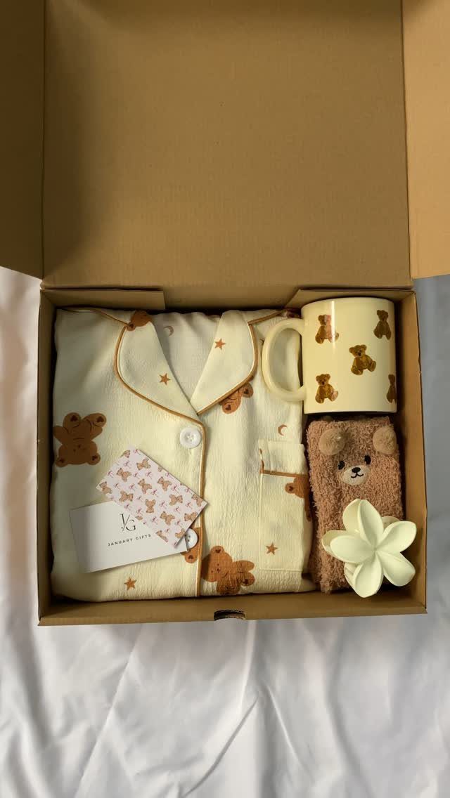 Cream pajama set with brown bears in a gift box with a mug.