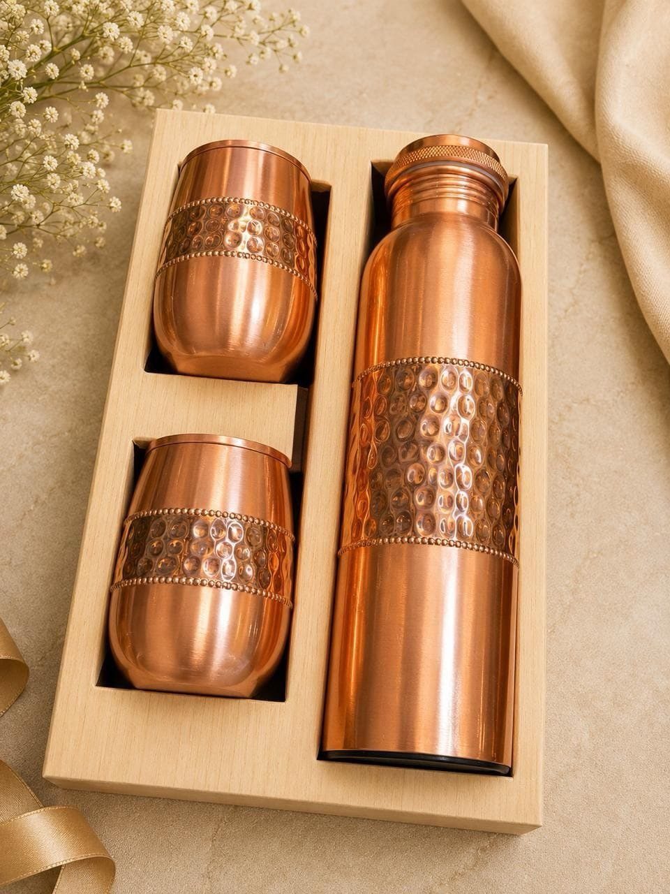 Copper water bottle and two matching cups in a wooden gift box