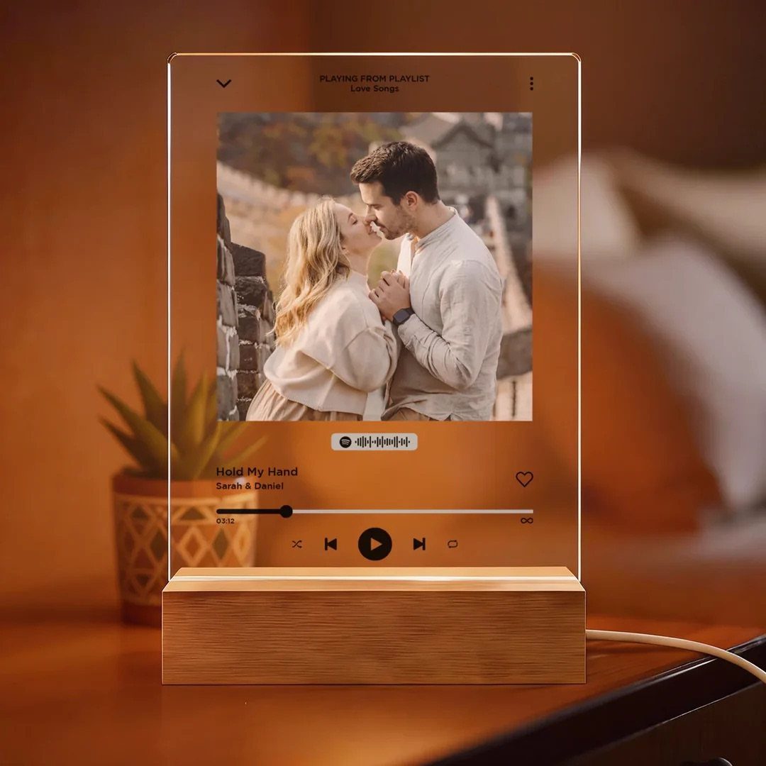 Acrylic Spotify song light box with a couple's photo and wooden base.