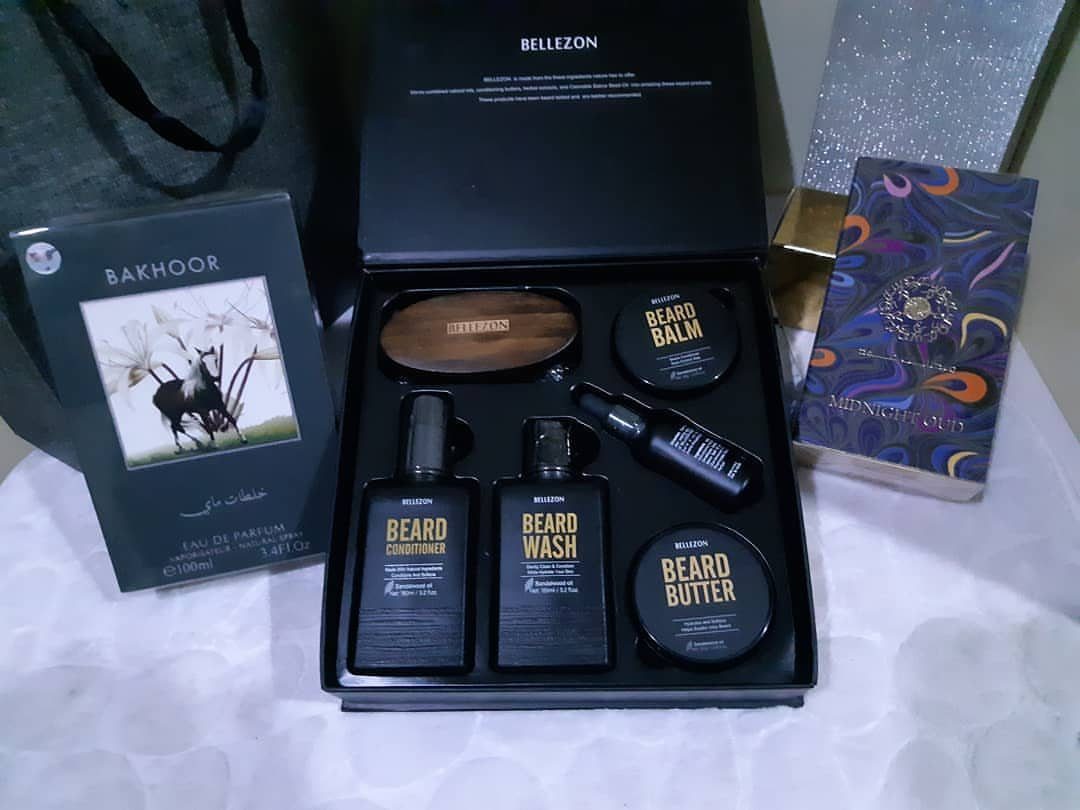 Beard care kit with conditioner, wash, butter, and balm in a black box.