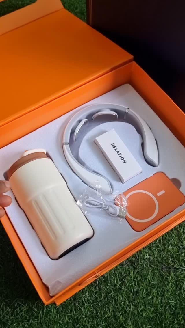 12 Useful Gifts for Men: From Chef's Knives to Multitools 12 Orange gift box with white tumbler, headphones, and power bank on green grass.