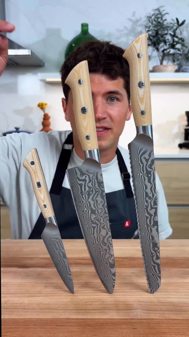 12 Useful Gifts for Men: From Chef's Knives to Multitools 7 Three professional chef's knives with patterned blades standing on a wooden cutting board.
