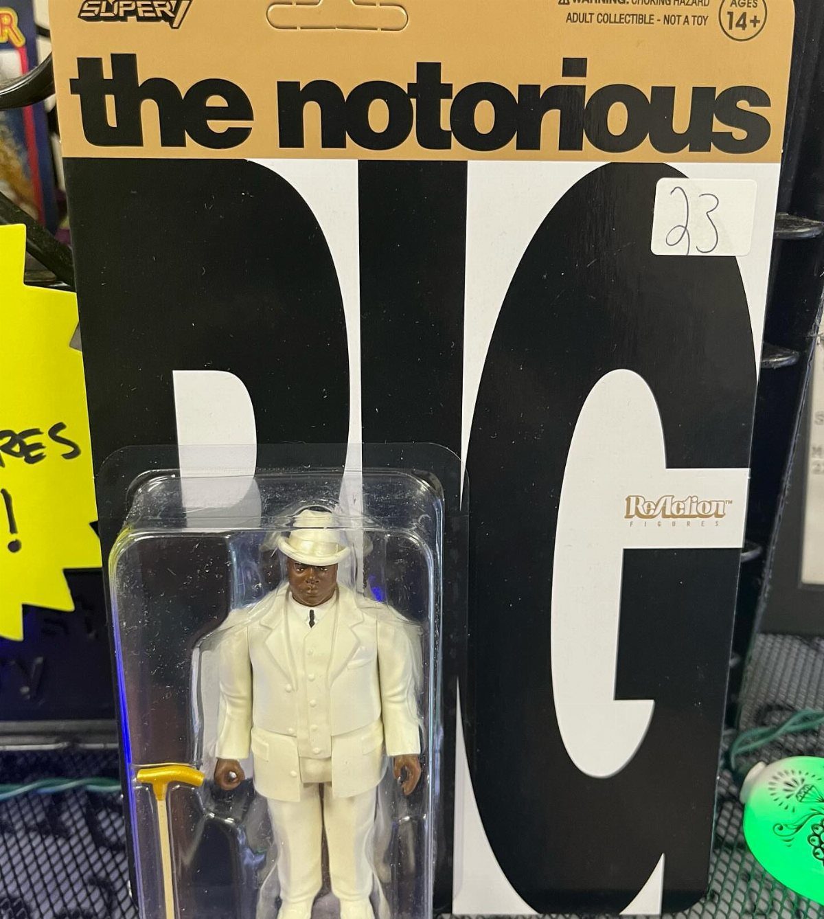 The Notorious Pig action figure in white suit and hat inside original packaging